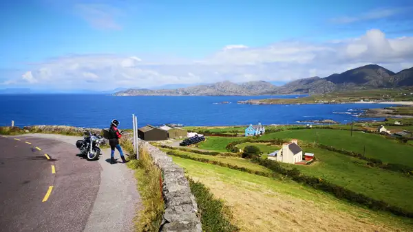 Rider and motorcycle at the western coast of Beara