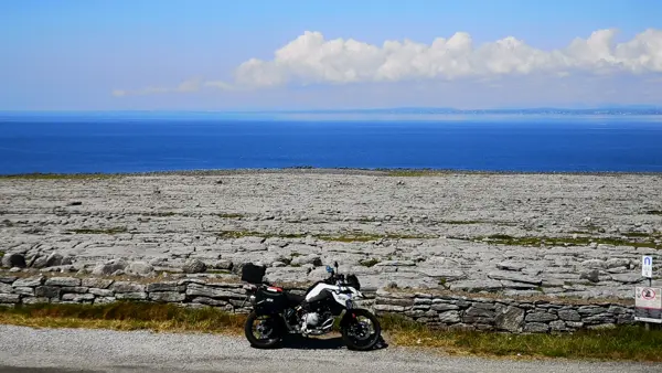 Motorcycle at the rocky coast of the Burren