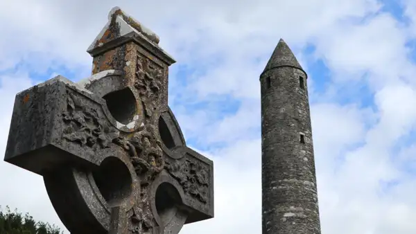 Round tower and celtic cross at Glendalough