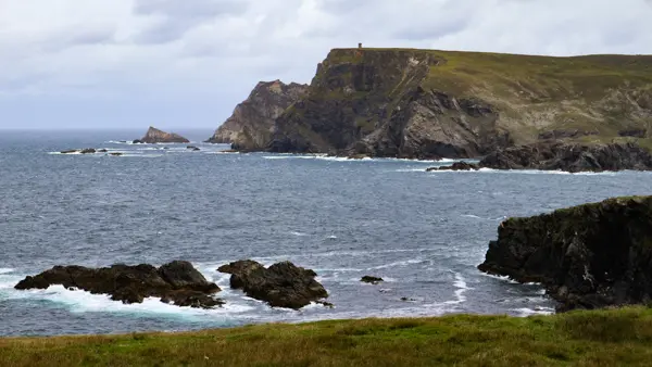 Tiny building on huge cliff at Glencolumbcille