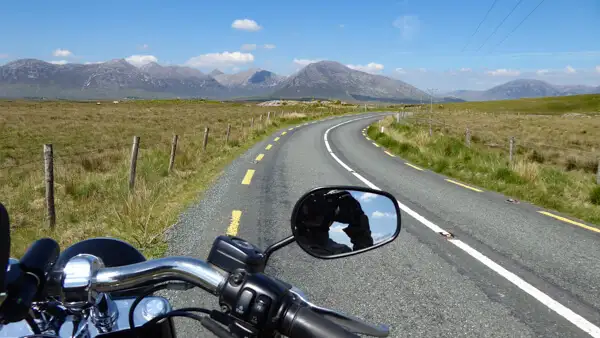Motorbike approaching the mountains of Connemara