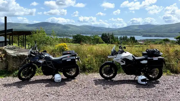 Two motorcycles at a rest stop