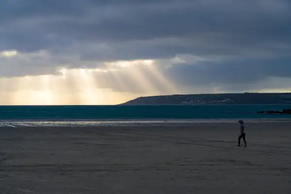 Cornwall beach at dawn with Penzance in the background