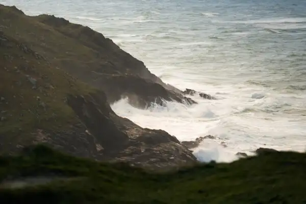 Waves crushing onto Cornwall cliffs