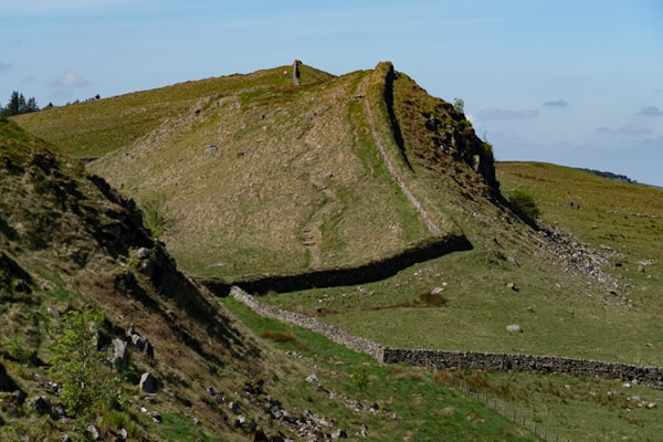 Looks like the Chinese wall, though smaller: Hadrians Wall over hills