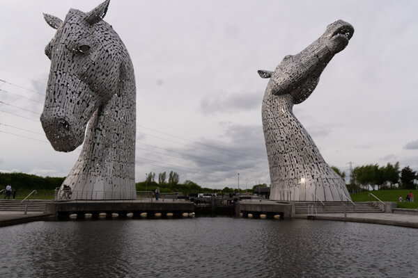 Massive statues and tiny visitors