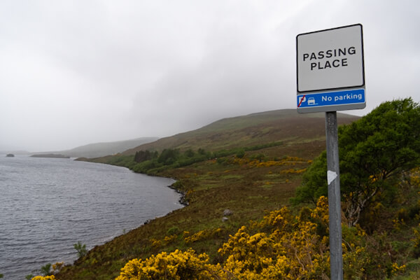 Sign on small single lane road