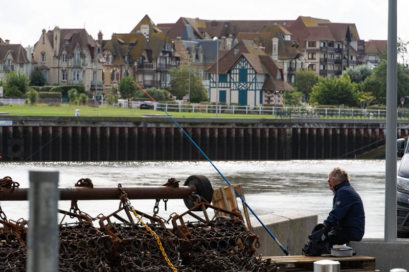 Fishing at the pier in Trouville (Normandie)